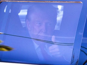 Former U.S. President Donald Trump in a car.