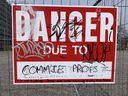 Graffiti on a sign near the University of Toronto reads