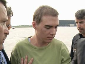 Luka Magnotta escorted by police.