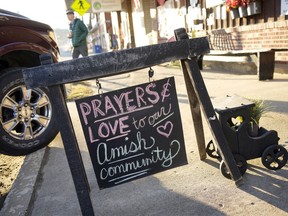 A sign on the sidewalk outside an antique store in Spartansburg, Pa., on Thursday, Feb. 29.