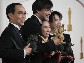 Masaki Takahashi, from left, Takashi Yamazaki, Kiyoko Shibuya and Tatsuji Nojima arrive at the Oscars on Sunday, March 10, 2024, at the Dolby Theatre in Los Angeles.