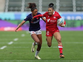 Canada's Asia Hogan-Rochester (right) breaks through the France defence on Day 3 of the HSBC SVNS Los Angeles at Dignity Health Sports Park In Carson, Calif. on Sunday, March 3, 2024.