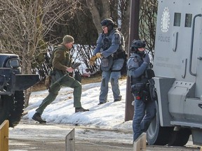 Police at the scene of a standoff with an armed person in a home in Penbrooke Meadows on March 15, 2024.