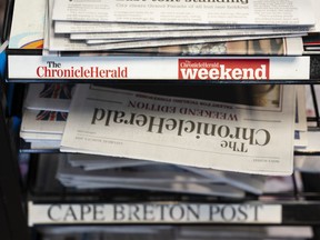 Newspapers owned by SaltWire Network Inc. are photographed in Halifax on Tuesday, March 12, 2024. A media expert says the decision by Atlantic Canada's largest newspaper company to seek protection from its creditors is another sign of the accelerating decline of the newspaper business.