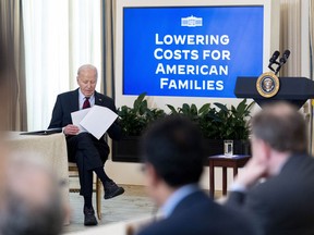President Joe Biden sits after speaking during a meeting with his Competition Council in the State Dining Room of the White House in Washington, Tuesday, March 5, 2024.