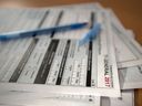 Tax forms are shown in Toronto on Thursday April 5, 2018. A Brampton, Ont., man has been given a three-year prison sentence for his role in a fraud case involving more than $34 million in false charitable donations.