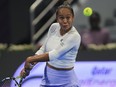 Canada's Leylah Fernandez returns to Kazakstan's Elena Rybakina during the Qatar Open quarterfinal in Doha, Qatar, on Thursday, Feb. 15, 2024.