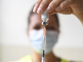 A health professional prepares a dose of a mpox vaccine at the Edison municipal vaccination centre in Paris Wednesday July 27, 2022. Toronto Public Health says 21 cases of mpox have been confirmed in the city since the start of this year compared with a total of 27 cases in all of 2023.