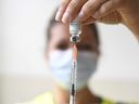 A health professional prepares a dose of the MPox vaccine at the Edison municipal vaccination center in Paris, Wednesday, July 27, 2022.