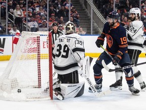 Los Angeles Kings goalie Cam Talbot (39) is scored on by Edmonton Oilers' Adam Henrique (19) during second period NHL action in Edmonton on Thursday March 28, 2024.