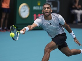 Felix Auger-Aliassime, of Canada, races for a ball from Adam Walton, of Australia, in their men's first round match at the Miami Open tennis tournament, Thursday, March 21, 2024, in Miami Gardens, Fla.THE CANADIAN PRESS/AP/Rebecca Blackwell