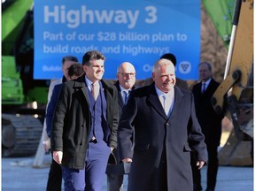 MPP Andrew Dowie, left, and Premier Doug Ford are shown at a press conference in Kingsville on Monday, March 11, 2024.