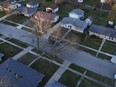 Police tape surrounds many homes as police investigate a mass stabbing along the 2300 block of Holmes Street on March 27, 2024, in Rockford, Ill.