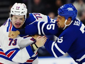 New York Rangers' Matt Rempe, a six-foot-seven forward turning heads across hockey, is getting some recognition from fans eight games into his NHL career -- mostly because of his fists. Rempe (73) and Toronto Maple Leafs' Ryan Reaves (75) fight during third-period NHL hockey action in Toronto on Saturday, March 2, 2024.