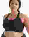 model wearing black sports bra