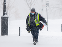 A Canada Post worker delivers mail during a snowstorm in Montreal.