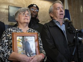 FILE - The family of Tekle Sundberg, including parents Cindy and Mark, speak during a news conference inside the Ramsey County Courthouse in St. Paul, Minn., Nov. 16, 2023. On Monday, March 25, 2024, the families of five men killed by police reached a settlement with the Minnesota Bureau of Criminal Apprehension in their lawsuit filed last fall, seeking the investigative files on the fatal shootings.