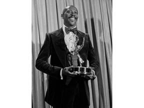 FILE - Louis Gossett Jr., poses with the Emmy he received for his role in the TV drama "Roots," at the Academy of Television, Arts and Sciences awards show in Los Angeles on Sept. 11, 1977. Gossett Jr., the first Black man to win a supporting actor Oscar and an Emmy winner for his role in the seminal TV miniseries "Roots," has died. He was 87. (AP Photo, File)