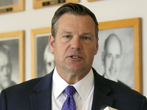 FILE - Kansas Attorney General Kris Kobach answers questions from reporters during a news conference outside his office, May 1, 2023, in Topeka, Kan. The Kansas judge ruled Monday, March 11, 2024 that the state isn't violating rights granted to transgender residents under the state constitution by refusing to change their driver's licenses to reflect their gender identity.