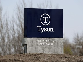 FILE - A sign sits in front of the Tyson Foods pork plant, April 22, 2020, in Perry, Iowa. Tyson Foods will continue streamlining its operations by closing the pork plant in Iowa that employs 1,200 people and eliminating the largest employer in the town of Perry. Tyson announced the plant closure Monday, March 11, 2024.