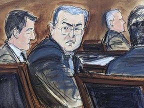 FILE - In this courtroom sketch from federal court in New York, Tuesday, Feb. 20, 2024, former Honduran President Juan Orlando Hernández, seated center at the defense table, turns to looks at prospective jurors during the jury selection process at the start of his trial. Hernández took the witness stand in his defense at his New York trial on Tuesday, March 5, denying that he teamed up with drug dealers to protect them in return for millions of dollars in bribes.
