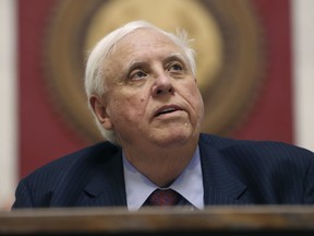 FILE - West Virginia Gov. Jim Justice delivers his State of the State address, Jan. 10, 2024, in Charleston, W.Va. Justice on Wednesday, March 27, broke with the GOP-majority Legislature to veto a bill that would have loosened one of the country's strictest school vaccination policies.