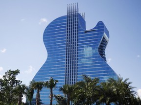 FILE - The guitar shaped hotel is seen at the Seminole Hard Rock Hotel and Casino on Thursday, Oct. 24, 2019, in Hollywood, Fla. The state of Florida and the Seminole Tribe of Florida will be raking in hundreds of millions of dollars from online sports betting this decade, thanks to a compact between the tribe and Gov. Ron DeSantis that gave the tribe exclusive rights to run sports wagers as well as casino gambling on its reservations.