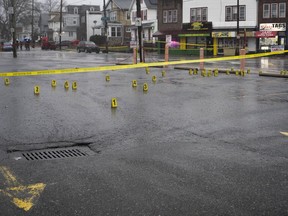 Evidence markers are seen following a shooting in Northeast Philadelphia on Wednesday, March 6, 2024. Four shootings over four days in Philadelphia left three dead and 12 injured, many of them children -- violence that put renewed focus on safety within the sprawling mass transit system and gave ammunition to critics of the city's progressive chief prosecutor.