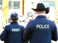 An Alberta Sheriff with a Calgary Police officer.