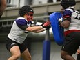 Nathaniel Dumoulin-Duguay (left), shown in a handout photo from the CFL combine, doesn't have any problem with football coaches yelling instructions or criticism.The offensive lineman out of Laval University spent almost a year in the Canadian Army and says basic training included long days starting at 4 a.m. and military personnel barking out orders.