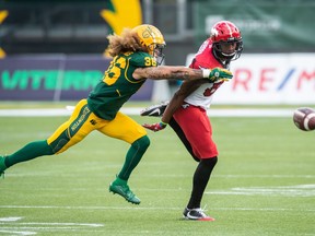 Edmonton Elks' Aaron Grymes (36) breaks up a pass intended for Calgary Stampeders' Kamar Jorden during first half CFL action in Edmonton on Saturday, Sept. 11, 2021. Grymes still considers himself a player but the veteran defensive back is looking ahead to his life after football. The 33-year-old American is among seven CFL players participating in the league's mentorship program in partnership with the CFL Players' Association.