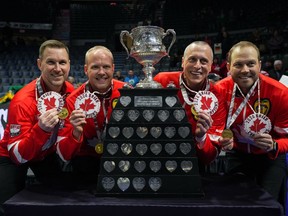 Canada skip Brad Gushue, from left to right, third Mark Nichols, second E.J. Harnden and lead Geoff Walker pose with the Brier Tankard and First Nations beadwork after defeating Saskatchewan in the final at the Brier, in Regina, Sunday, March 10, 2024.