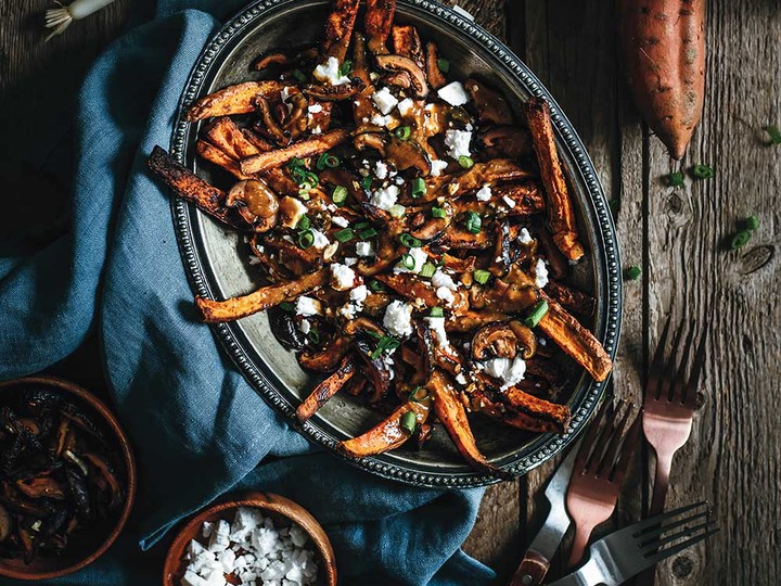  “I am a Montrealer at heart, so I had to include a poutine recipe in this cookbook,” writes Murielle Banackissa. For a more traditional version, swap the sweet potatoes for russet or Yukon Gold potatoes.