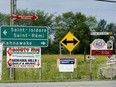 Road signs for Kahnawake reserve.