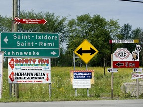 Road signs for Kahnawake reserve.