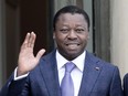FILE - Togo's President Faure Gnassingbe waves before a working lunch at the Elysee Palace in Paris on April 9, 2021. Activists and opposition leaders in the West African country of Togo called on Wednesday, March 27, 2024, for protests to stop the country's president from signing off on a new constitution that would scrap future presidential elections and could extend his decades-long rule until 2031.