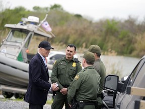 President Joe Biden talks with the U.S. Border Patrol, as he looks over the southern border, Thursday, Feb. 29, 2024, in Brownsville, Texas, along the Rio Grande.