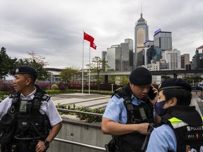 Police officers stand guard outside the Legislative Council in Hong Kong