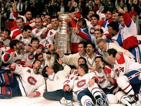The Montreal Canadiens pose for a photograph with the Stanley Cup in 1993.