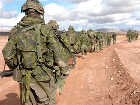 1 Royal Canadian Regiment (RCR) Charlie Company(C Coy) walks back to their vehicle after one of their training stands during Exercise Maple Guardian at Fort Irwin, California, USA.