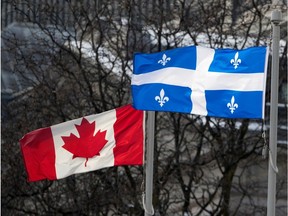 The flags of Quebec and Canada are shown on flagpoles.