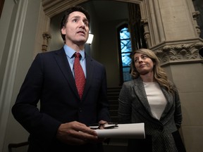Prime Minister Justin Trudeau, front centre, and Foreign Affairs Minister Melanie Joly