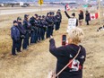 Alberta RCMP stop demonstrators from gathering on the Trans-Canada Highway near Highway 22 west of Calgary on Tuesday, April 2, 2024.