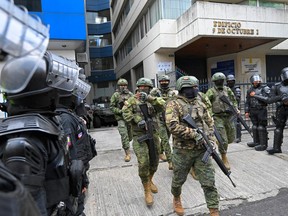 Military and police officers deploy a security operation