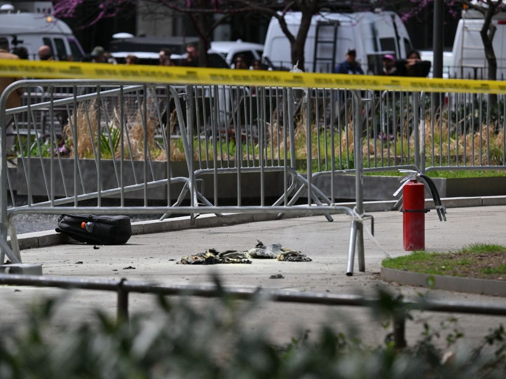 NextImg:Person who was on fire outside Trump trial is rushed away on a stretcher
