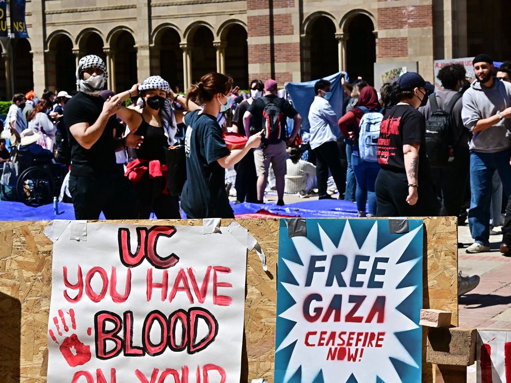 NextImg:Protesters dig in as some schools close encampments after reports of antisemitic activity