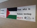 A sign falsely suggesting that Israel is conducting human testing on Palestinian prisoners is seen at a Peel District secondary school in Mississauga, Ont., in 2019.