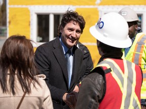 Prime Minister Justin Trudeau greets contractors following a housing announcement in Dartmouth, N.S. on Tuesday.