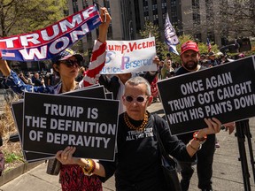 Protesters outside Donald Trump trial.
