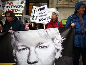 People protest Julian Assange's detention.
